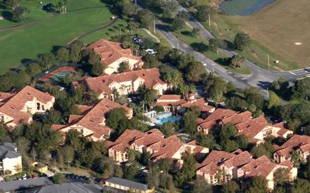 aerial shot of residential home with tile roofs