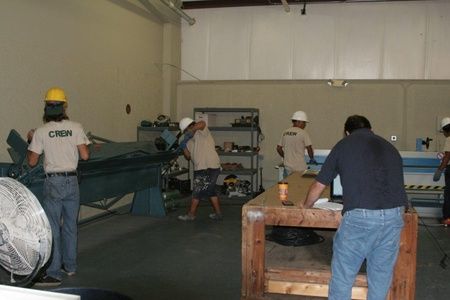 ANC Roofing workers working in the warehouse