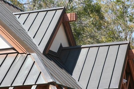 Close up of a home with a metal roof