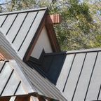 Close up of a home with a metal roof