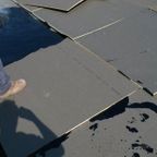 ANC roofer installing a flat rooftop