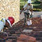 ANc Roofers installing a tile roof on a residential home