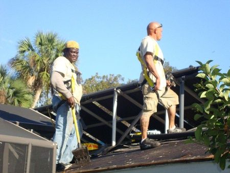 ANC Roofing employees working on a residential roofing project