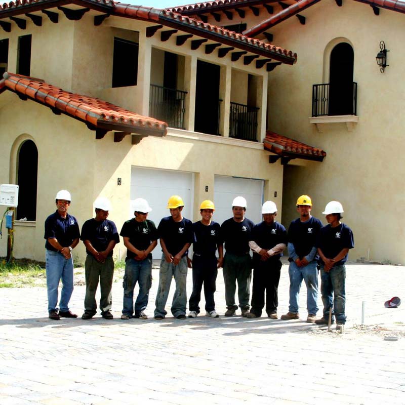 A group of men is standing in front of a house in Orlando, FL