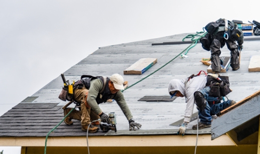 ANC Roofing team installing shingles on a residential roof in Orlando, FL