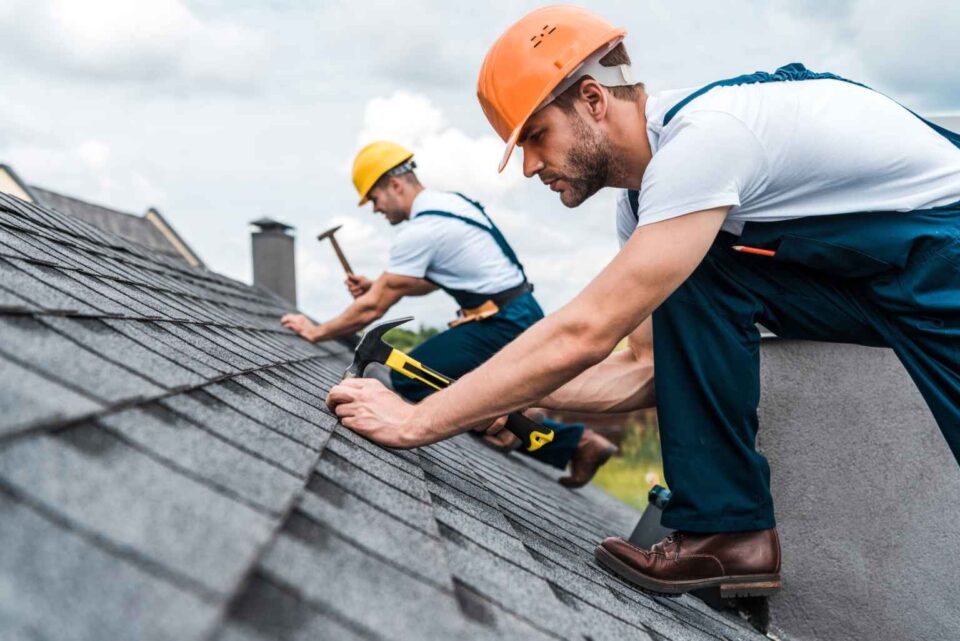 ANC Roofing professionals replacing asphalt shingles on a sloped roof in Orlando, FL