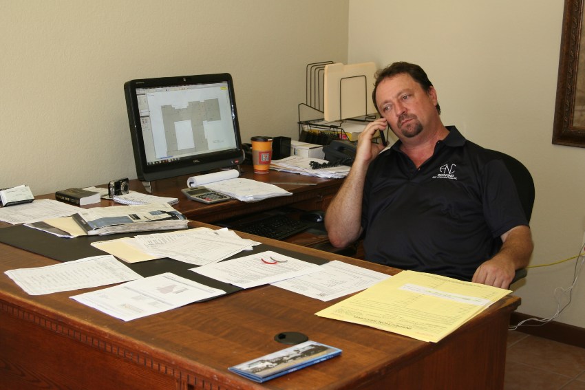 Office representative reviewing payment paperwork and financing options with customer support